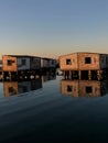 Vintage wooden houses on the shoreline of a tranquil body of water in Jeddah, Saudi Arabia