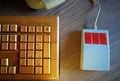 Vintage wooden keyboard with red mouse background Royalty Free Stock Photo