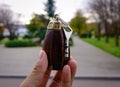 Vintage wooden keychain in the hand Royalty Free Stock Photo