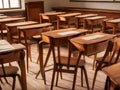 Vintage wooden lecture chairs and tables in classroom interior