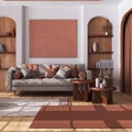 Vintage wooden living room with curtains, fabric sofa, tables and carpet in white and orange tones. Parquet floor and arched door Royalty Free Stock Photo