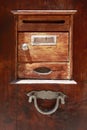 Vintage wooden mailbox on a wooden door