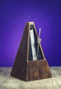Vintage wooden metronome used to keep tempo in music