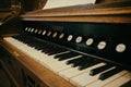 vintage wooden pianino with black and white keys