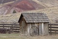 Vintage Wooden Pump House With Wagon Wheel