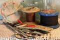 VINTAGE WOODEN REELS WITH ROBUST THREAD AND NEEDLEWORK ITEMS Royalty Free Stock Photo