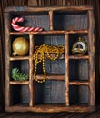 Vintage wooden shadow box with candy canes, christmas tree toy and golden watch Royalty Free Stock Photo