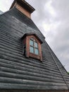 Vintage wooden skylight in the plank roof of an old building