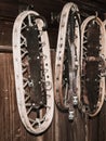 Vintage wooden snowshoes hanging on the wall in mountain cottage