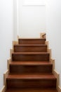 Vintage wooden staircase in home. The stairs up inside the house that painted the white walls Royalty Free Stock Photo