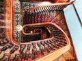 Vintage wooden stairway with plush carpeting in an old castle in New Zealand.