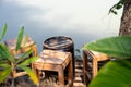 vintage wooden stools on wooden balcony under tree, facing river with light and shadow Royalty Free Stock Photo