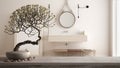 Vintage wooden table shelf with pebble and potted bloom bonsai, white flowers, over modern bathroom with sink and mirror, modern Royalty Free Stock Photo