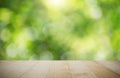 Vintage wooden tabletop on blurred green nature bokeh background Royalty Free Stock Photo