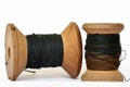 Vintage wooden thread spools on white background Royalty Free Stock Photo