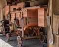 A vintage wooden threshing machine.
