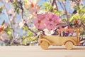 Vintage wooden toy car over wooden table. Nostalgia and simplicity concept. Royalty Free Stock Photo