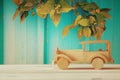 Vintage wooden toy car over wooden table Royalty Free Stock Photo
