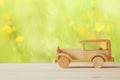 Vintage wooden toy car over wooden table Royalty Free Stock Photo