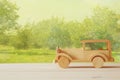 Vintage wooden toy car over wooden table Royalty Free Stock Photo