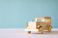 Vintage wooden toy car over wooden table Royalty Free Stock Photo