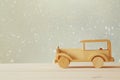 Vintage wooden toy car over wooden table. Royalty Free Stock Photo