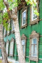 Vintage wooden house with lace curtain, Tomsk Russia Royalty Free Stock Photo