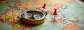 Vintage world map with compass, location markers. Travel planning concept. Adventure, exploration theme. Possible destinations
