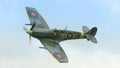 A vintage world war two British Spitfire fighter plane in flight Royalty Free Stock Photo