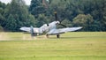 A vintage world war two British Spitfire fighter plane landing on airfileld Royalty Free Stock Photo