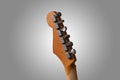 Vintage worn electric guitar head close up with retro tuners Royalty Free Stock Photo