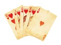 Vintage worn out hearts royal flush poker cards wooden table top Royalty Free Stock Photo