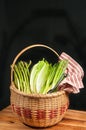 Vintage woven reed basket of organic, green vegetable