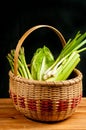 Vintage woven reed basket of organic, green vegetable Royalty Free Stock Photo