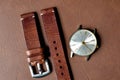 Vintage wristwatch on a brown leather background. Classic watch straps, Genuine handcraft italian calfskin leather.