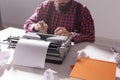 Vintage, writer and hipster concept - young stylish writer working on typewriter Royalty Free Stock Photo