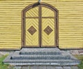 Vintage yellow aged wooden church doors