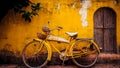 Vintage yellow bicycle leaning against retro wall. Tuscan vibe, old school travel Royalty Free Stock Photo