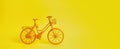 The vintage yellow bicycle parking against yellow wall. Royalty Free Stock Photo