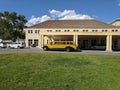 Vintage bus parked in front of Mammoth Hot Springs Hotel at Yellowstone National Park