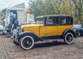 Vintage yellow car Ford A at a car show parked