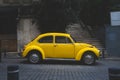 vintage yellow car parked outdoors. retro style. antique vehicle