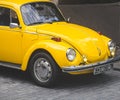 vintage yellow car parked outdoors. retro style. antique vehicle Royalty Free Stock Photo