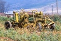 Vintage Yellow Farm Implement Against Rural Farm Landscape