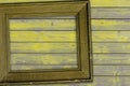 vintage yellow frame lies on wooden surface