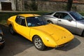 Vintage yellow Lombardi Gran Prix OTAS, parked at the road side