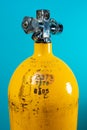 Vintage yellow steel scuba tank with hydrostatic test dates