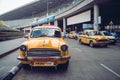 Vintage yellow taxi in the airport Parking lot. KOLKATA, INDIA - 26 January 2018 Royalty Free Stock Photo