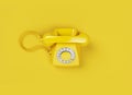 Vintage yellow telephone on yellow background. Render 3d illustration