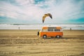 Vintage yellow van on the beach with cloudy sky on background, retro color effect. Oceano Dunes, California Central Coast Royalty Free Stock Photo